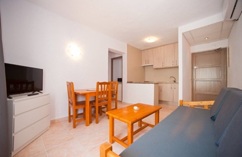 Santa Eulalia del Rio Apartment | Apartment Ses Veles 1 dormitorio close to the Beach with Sea View, Pool, Wi-Fi & Garden