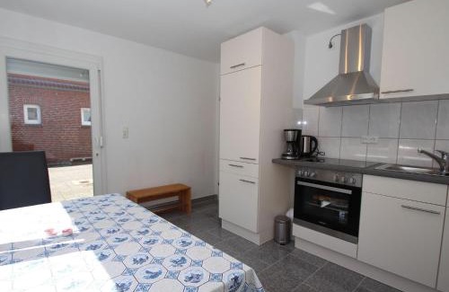 Uttel Apartment | Apartment with a high chair and bed