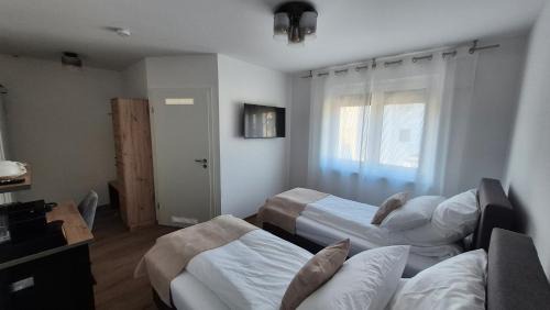 Sondelfingen House | Apartments Seibel Doppel-Zweibettzimmer mit Bad