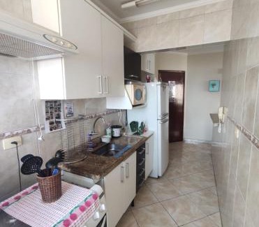 Mirim Apartment | Apto a 50m da praia, com ar condicionado, wifi , portaria 24h