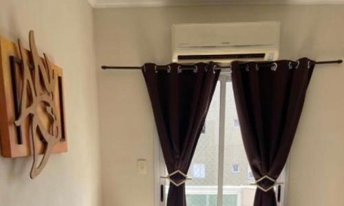 Mirim Apartment | Apto a 50m da praia, com ar condicionado, wifi , portaria 24h