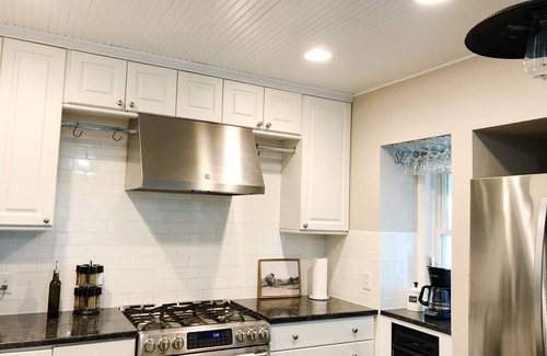 Isanti House | Architectural lake home with a monthly discount