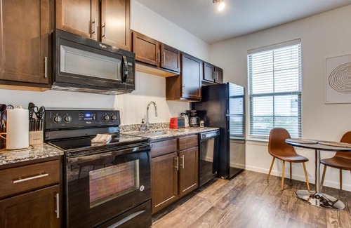McNeil Apartment | Astonishing CozySuites on I-35 with pool&parking #11