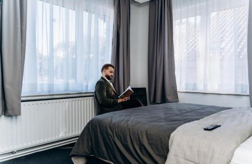 Strombeek-Bever Hotel | Atomihotel: Contemporary Comfort Steps from the Atomium!