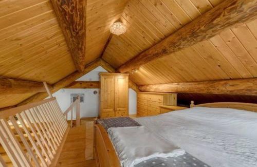 Central Okanagan Ski Chalet | Authentic lofted log cabin with hot tub