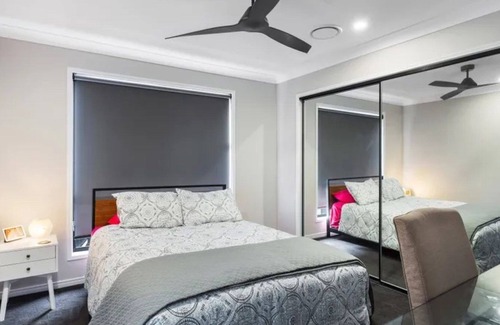 Banksia Beach House | Bailies Retreat - Modern townhouse with pool plus lake and golf course views