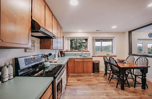 Camano Island Apartment | Baker View Lodging with hot tub, sound, mountain, and territorial views.