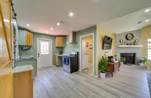 Barling House | Barling Vacation Rental Fenced-In Yard with Hot Tub