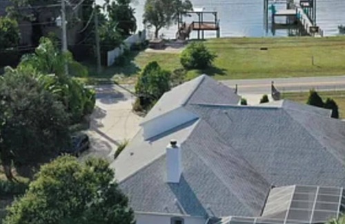 Merritt Island Villa | Barrier island water front luxury villa w dock near beaches and Disney Orlando