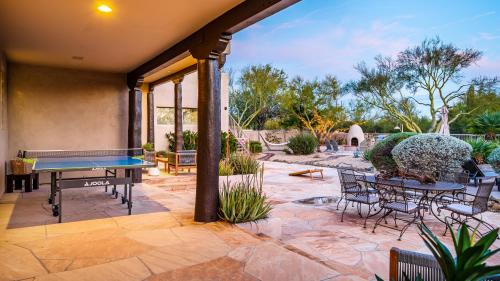 Desert View Village House | Barwick is a private oasis Practice on the putting green shoot pool and enjoy this city getaway.