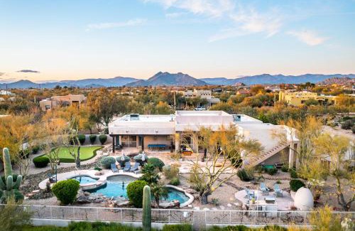 Desert View Village House | Barwick is a private oasis Practice on the putting green shoot pool and enjoy this city getaway.