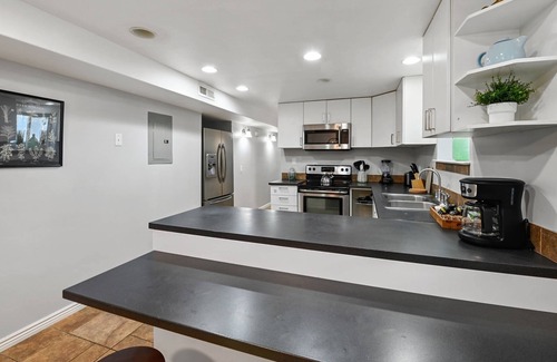 Sandy Apartment | Basement Retreat: Private Entry, Updated, Ski Passes, Sleeps 8, Near Trax Station, 3 TVs, Patio!