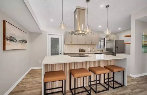 Bayshore Gardens House | Bayshore Gardens remodel with hot tub + fire pit + walk to park and marina