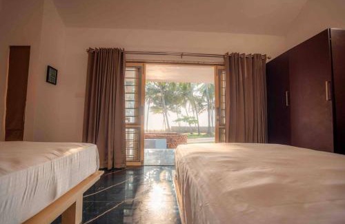 Elathur Villa | Baywatch by Grha - A Picturesque Beachfront Villa