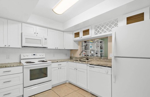 Port Canaveral Condo | Beach 50 feet from back patio door with Pool and Hot Tub!