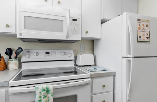 Avon By The Sea Condo | Beachfront 2BR Condo W/Pool BBQ & Steps To Beach Close to Space Center and Dini