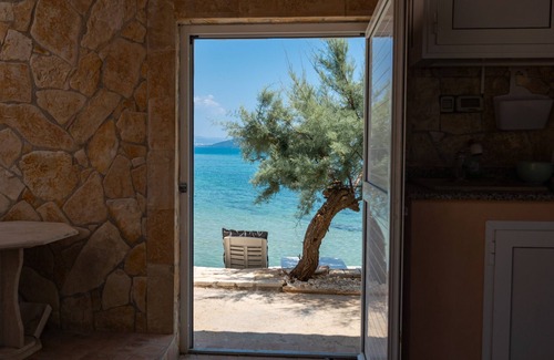 Trogir Villa | Beachfront villa Mihovil with direct beach access, garden, pool and mooring