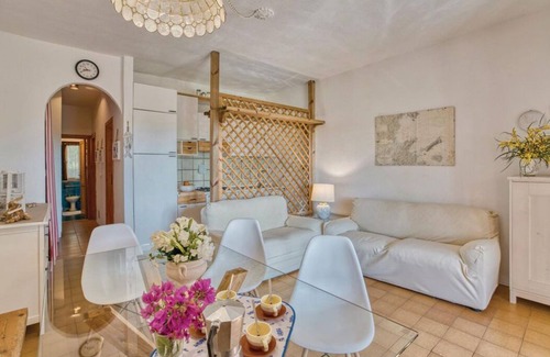 Porto Istana Apartment | Beautiful bay of white sand and clear sea opposite the island Tavolara