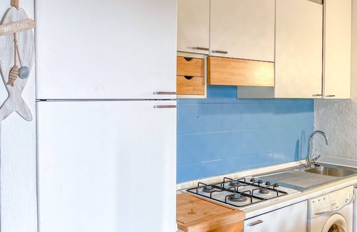Porto Istana Apartment | Beautiful bay of white sand and clear sea opposite the island Tavolara