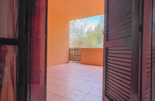 Porto Istana Apartment | Beautiful bay of white sand and clear sea opposite the island Tavolara