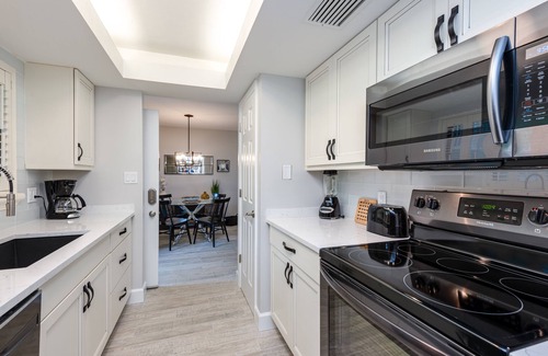 Bonita Bay Condo | Beautiful Condo with great views of lake & golf course, access to Private Beach