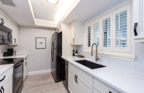 Bonita Bay Condo | Beautiful Condo with great views of lake & golf course, access to Private Beach