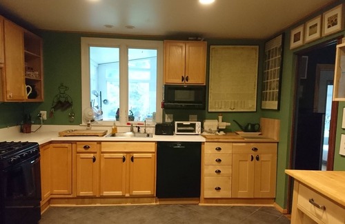 Colesville House | Beautiful home with shady front porch and rear sunroom in tree lined backyard.