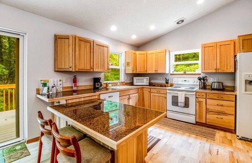 Netarts House | Beautiful home with large deck, gas grill, nestled around the trees