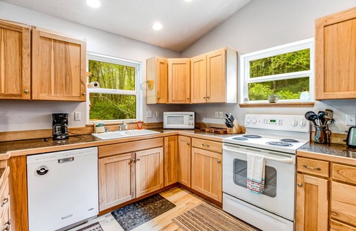 Netarts House | Beautiful home with large deck, gas grill, nestled around the trees