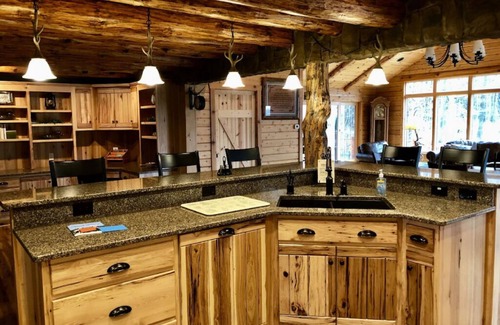 Dundee Cabin | Beautiful Log Cabin nestled in the woods of Amish Country. Relax in our hot tub!