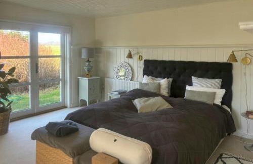 Vester Skerninge House | Beautiful Log House With A Pool In South Funen