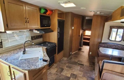 Dade City House | Beautiful travel trailer with private fenced in yard, deck, and fire pit.