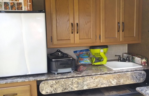 Dade City House | Beautiful travel trailer with private fenced in yard, deck, and fire pit.
