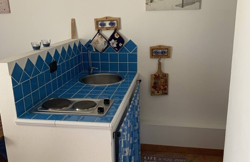 Porto Pino Apartment | Beautiful two-room apartment in a villa with air conditioning