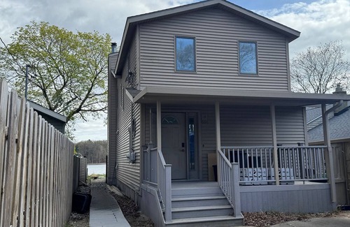 Norton Shores House | Beautiful Waterfront Getaway on Mona Lake in Norton Shores