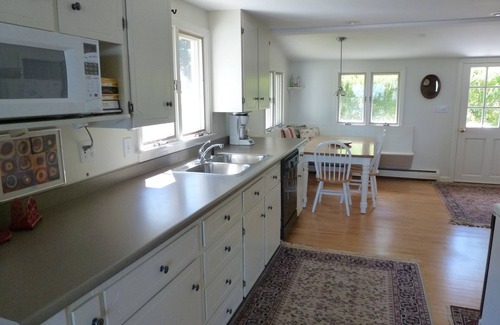 Raymond House | Beautifully landscaped home on Panther Pond just 20 feet from the shore!