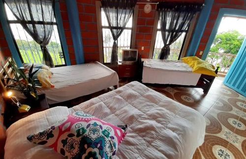 Titiribi Bed & Breakfast | Bed and bath at Villacarolina