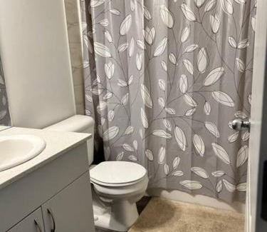 Southwest Edmonton House | Bedroom with private bathroom in Southwest