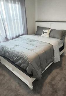 Southwest Edmonton House | Bedroom with private bathroom in Southwest