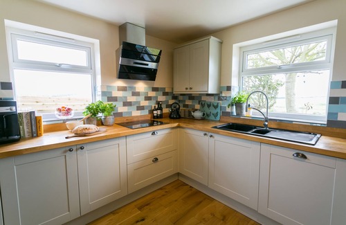 Cemaes Bay Cottage | Bettws Farmhouse - a ground floor bedroom that sleeps 8 guests in 4 bedrooms