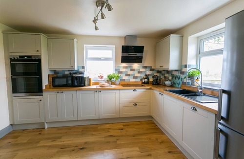 Cemaes Bay Cottage | Bettws Farmhouse - a ground floor bedroom that sleeps 8 guests in 4 bedrooms