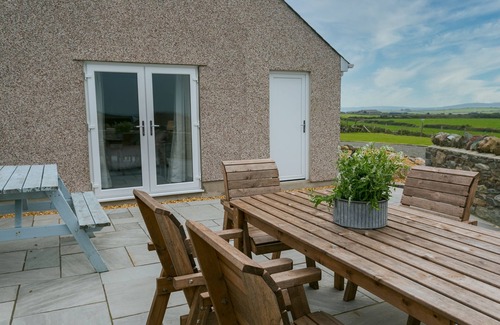 Cemaes Bay Cottage | Bettws Farmhouse - a ground floor bedroom that sleeps 8 guests in 4 bedrooms
