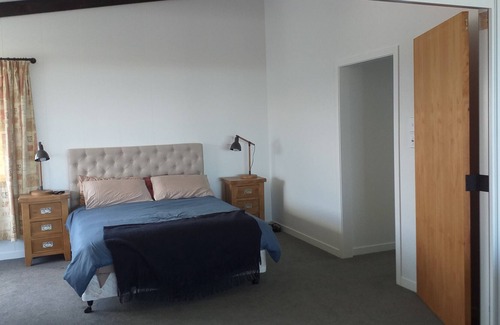 Waiotahi House | Big Black Beachfront Bach in family friendly community.