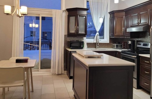 Laval House | Big house with garage, patio and backyard