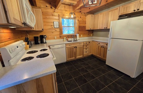 Swanton House | Bigg's Bear Cabin, a spacious 3-bedroom retreat perfect for up to 10 guests.