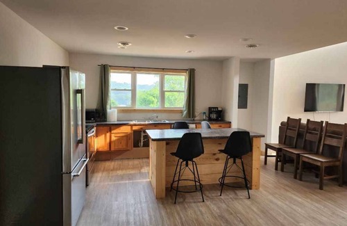 Decorah Villa | Bluffside Gardens Oak Series 11 Person Cabin Unit 6