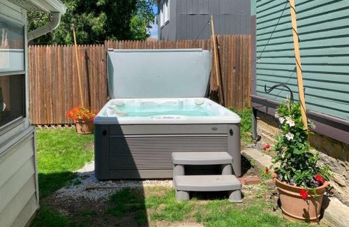 Winooski Falls Mill District Apartment | Bohemian Compound with Hot Tub