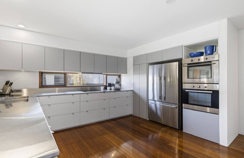 Emerald Beach Apartment | Breathtaking Views, Shared Pool and Yard, Steps from Beach