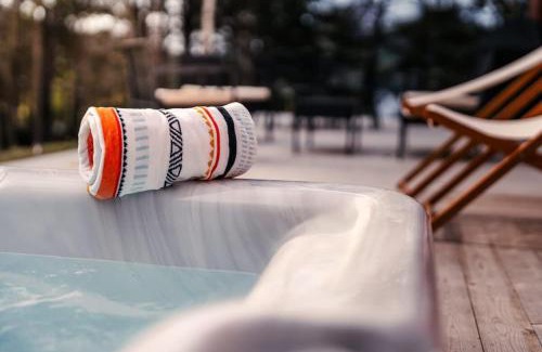 Lac Superieur Village Ski Chalet | Bright chalet with hot tub and indoor sauna