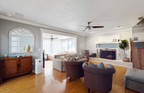 Spring Hill House | Bright & charming beach retreat with large lanai, firepit, & fireplace - dogs ok